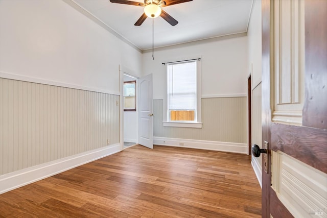 24 S University St, Healdsburg, CA 95448 - spare room with wood finished floors, wainscoting, and ceiling fan