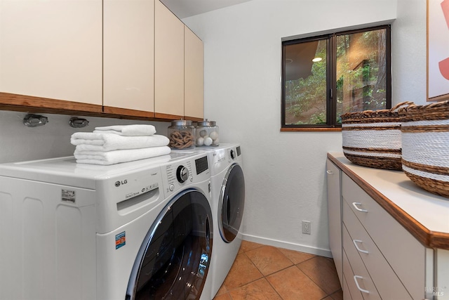 1655 Jonive Rd, Sebastopol, CA 95472 - laundry area with cabinet space, washer and dryer, baseboards, and light tile patterned floors