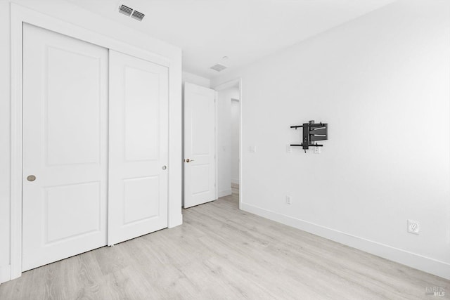 339 Pear Tree Ter Unit C, Napa, CA 94558 - unfurnished bedroom featuring baseboards, light wood-style floors, and a closet