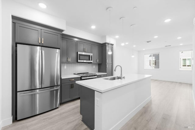 339 Pear Tree Ter Unit C, Napa, CA 94558 - kitchen featuring appliances with stainless steel finishes, a sink, light wood finished floors, light countertops, and recessed lighting