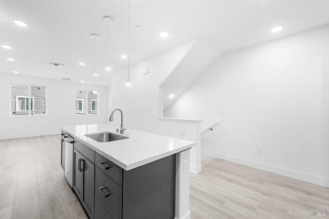 339 Pear Tree Ter Unit C, Napa, CA 94558 - kitchen with a sink, light wood-style flooring, a kitchen island with sink, light countertops, and recessed lighting