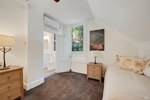 1423 Foothill Blvd, Calistoga, CA 94515 - bedroom featuring an AC wall unit, lofted ceiling, dark carpet, connected bathroom, and baseboards
