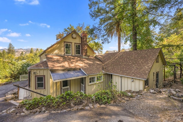 1423 Foothill Blvd, Calistoga, CA 94515 - rustic home featuring a chimney, roof with shingles, and board and batten siding