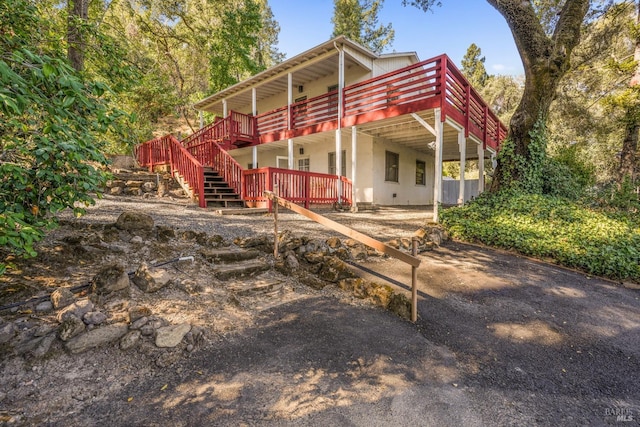 1423 Foothill Blvd, Calistoga, CA 94515 - rustic home with a wooden deck, stairway, and central air condition unit