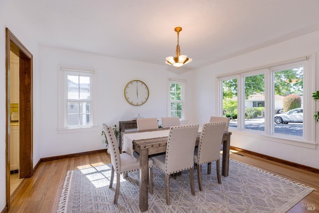 31 Laurel Ave, Petaluma, CA 94952 - dining room with plenty of natural light, baseboards, light wood-style floors, and a chandelier