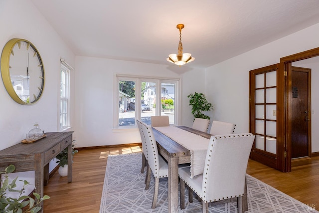 31 Laurel Ave, Petaluma, CA 94952 - dining area with light wood-style flooring, a chandelier, and baseboards