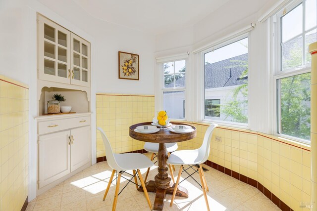 31 Laurel Ave, Petaluma, CA 94952 - dining room with tile walls, healthy amount of natural light, and a wainscoted wall