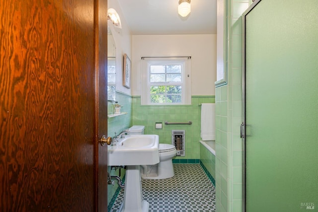 31 Laurel Ave, Petaluma, CA 94952 - bathroom with a wainscoted wall, toilet, heating unit, an enclosed shower, and a tile fireplace
