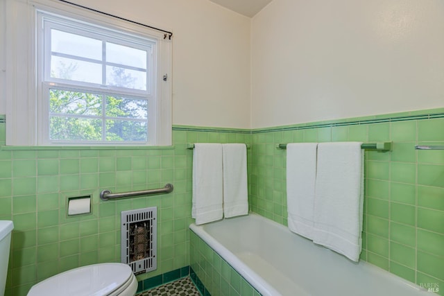 31 Laurel Ave, Petaluma, CA 94952 - bathroom with tile walls, toilet, heating unit, tile patterned floors, and tiled tub