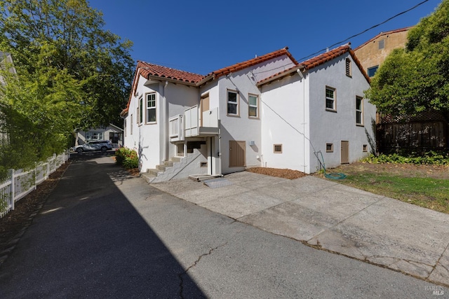 31 Laurel Ave, Petaluma, CA 94952 - view of front of home featuring driveway, a tiled roof, and stucco siding