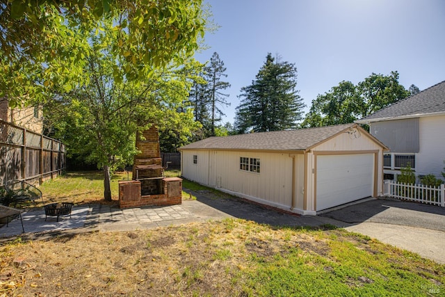 31 Laurel Ave, Petaluma, CA 94952 - view of yard with a fireplace, a detached garage, a patio, and an outdoor structure