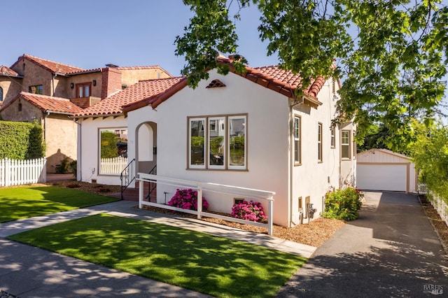 31 Laurel Ave, Petaluma, CA 94952 - mediterranean / spanish house with stucco siding, a detached garage, an outdoor structure, and a tile roof