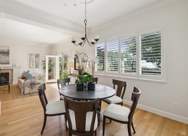 15 Upland Ln, Novato, CA 94945 - dining space featuring healthy amount of natural light, a chandelier, ornamental molding, and wood finished floors