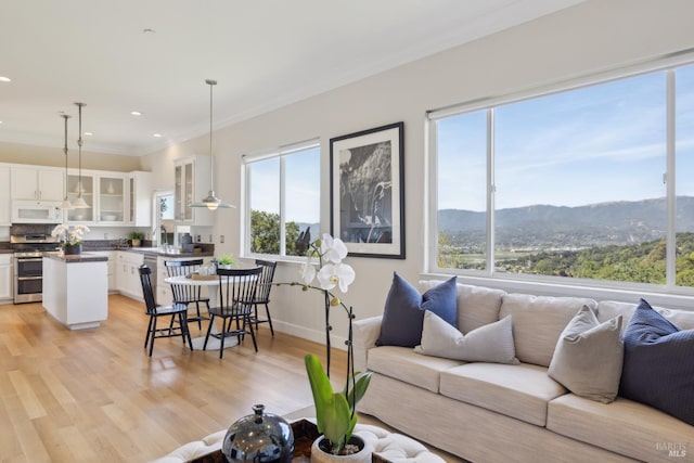 15 Upland Ln, Novato, CA 94945 - living area featuring crown molding, light wood-style floors, a mountain view, recessed lighting, and baseboards