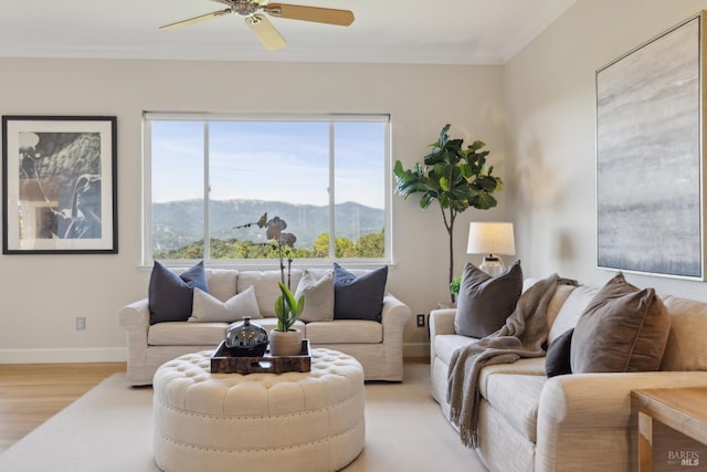 15 Upland Ln, Novato, CA 94945 - living room featuring a mountain view, ceiling fan, light wood-style floors, crown molding, and baseboards