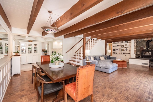 1114 Mount George Ave, Napa, CA 94558 - dining space with a wood stove, stairs, beam ceiling, and dark wood-type flooring