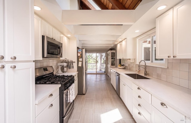 1114 Mount George Ave, Napa, CA 94558 - kitchen featuring stainless steel appliances, a sink, white cabinets, tasteful backsplash, and recessed lighting