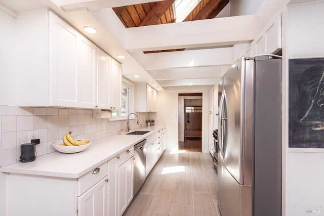 1114 Mount George Ave, Napa, CA 94558 - kitchen with appliances with stainless steel finishes, decorative backsplash, white cabinets, a sink, and recessed lighting