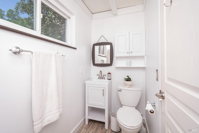 1114 Mount George Ave, Napa, CA 94558 - bathroom featuring vanity, wood finished floors, toilet, beamed ceiling, and baseboards