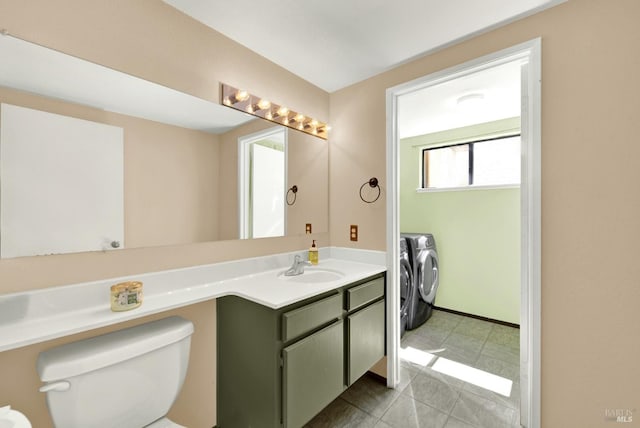 3265 Arroyo Dr, Fairfield, CA 94533 - half bathroom with washing machine and dryer, toilet, vanity, and tile patterned floors