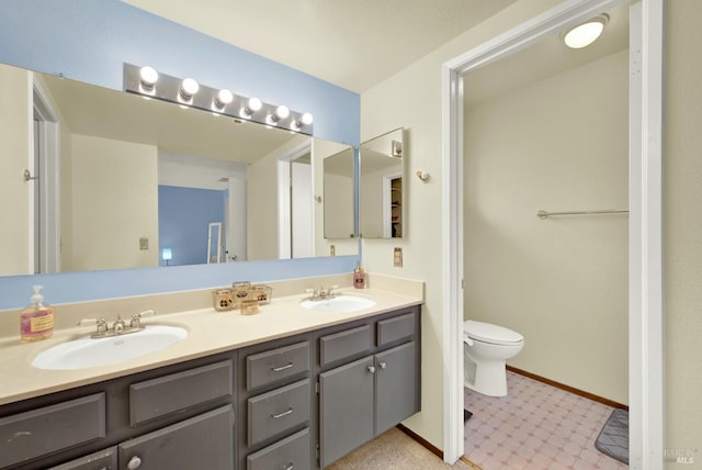 3265 Arroyo Dr, Fairfield, CA 94533 - full bathroom featuring toilet, double vanity, tile patterned floors, and baseboards