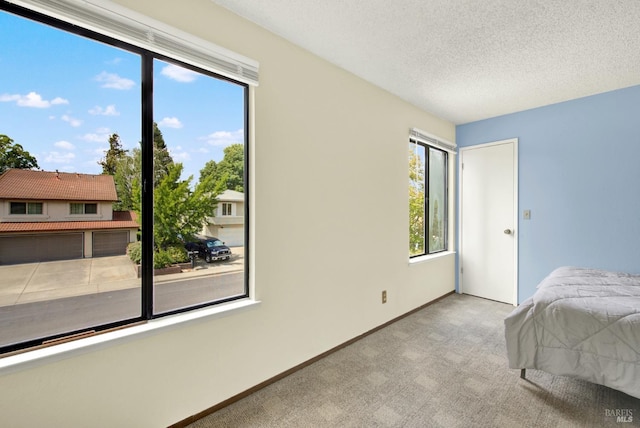 3265 Arroyo Dr, Fairfield, CA 94533 - bedroom featuring carpet floors, a textured ceiling, and baseboards