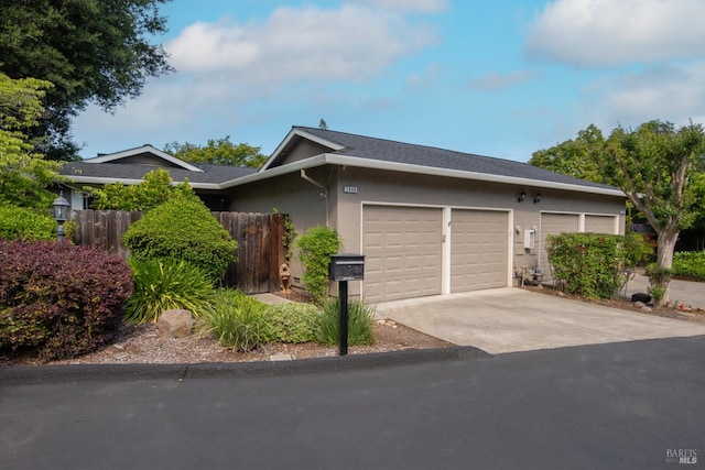 2698 Reuben Ct, Napa, CA 94558 - view of property exterior with an attached garage, driveway, and stucco siding