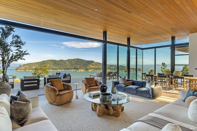 2215 Vistazo St E, Tiburon, CA 94920 - living area with a water and mountain view, expansive windows, wooden ceiling, and healthy amount of natural light