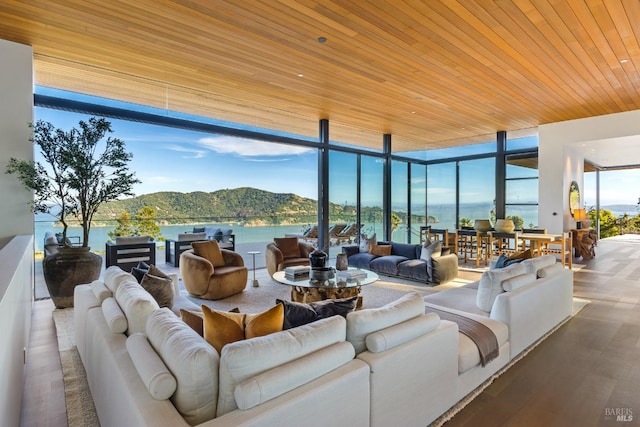 2215 Vistazo St E, Tiburon, CA 94920 - living area featuring a wall of windows, a water and mountain view, wooden ceiling, and wood finished floors
