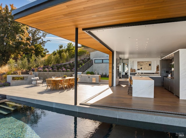 2215 Vistazo St E, Tiburon, CA 94920 - view of patio featuring outdoor dining area, stairway, and a sink