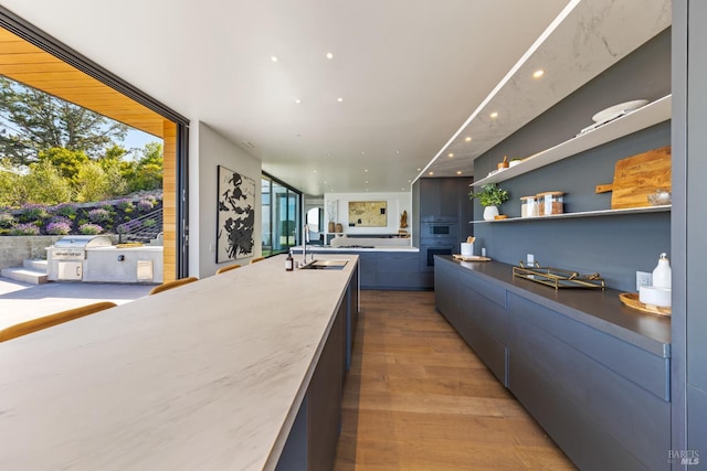 2215 Vistazo St E, Tiburon, CA 94920 - bar featuring a sink, oven, light wood finished floors, and recessed lighting