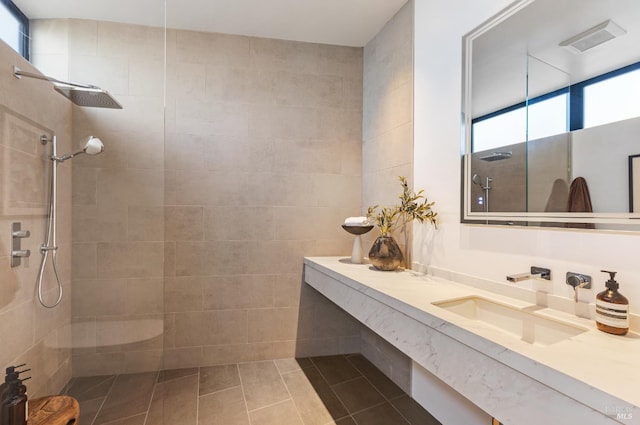 2215 Vistazo St E, Tiburon, CA 94920 - full bathroom with a tile shower, tile patterned flooring, vanity, and tile walls