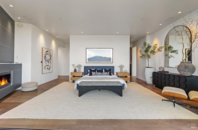 2215 Vistazo St E, Tiburon, CA 94920 - bedroom with a fireplace, recessed lighting, and wood finished floors