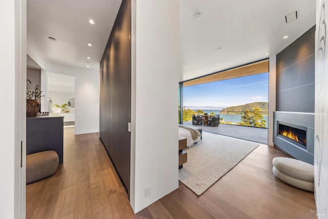 2215 Vistazo St E, Tiburon, CA 94920 - hallway featuring wood finished floors, a water view, recessed lighting, and expansive windows