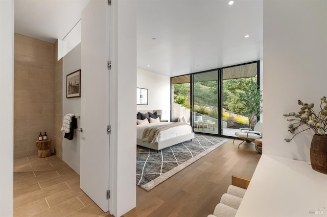 2215 Vistazo St E, Tiburon, CA 94920 - bedroom featuring a wall of windows, recessed lighting, access to outside, and ensuite bath