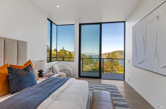 2215 Vistazo St E, Tiburon, CA 94920 - bedroom featuring access to exterior, wood finished floors, floor to ceiling windows, and recessed lighting