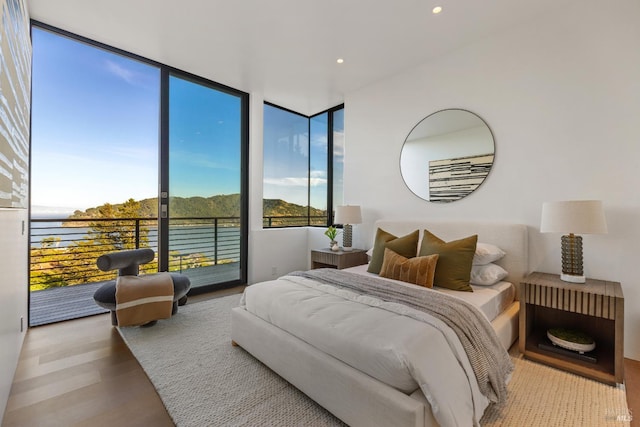 2215 Vistazo St E, Tiburon, CA 94920 - bedroom with access to outside, wood finished floors, recessed lighting, and a water view
