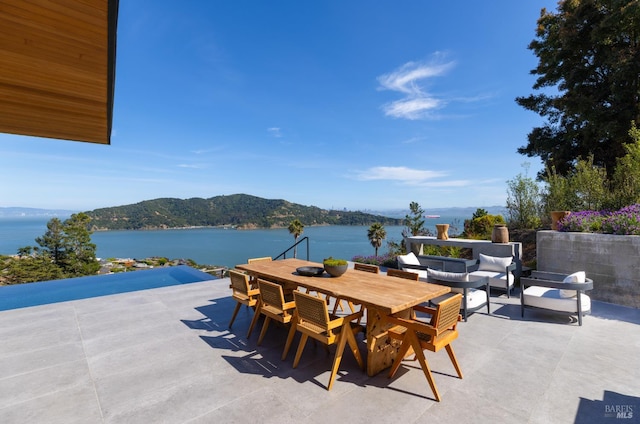 2215 Vistazo St E, Tiburon, CA 94920 - view of patio / terrace with a water and mountain view, outdoor dining space, and an outdoor living space