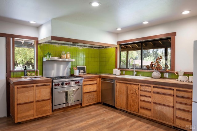 5900 Blank Rd, Sebastopol, CA 95472 - kitchen with appliances with stainless steel finishes, a sink, healthy amount of natural light, light wood-type flooring, and recessed lighting