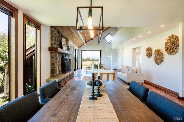5900 Blank Rd, Sebastopol, CA 95472 - dining area featuring recessed lighting, a stone fireplace, lofted ceiling, and baseboards
