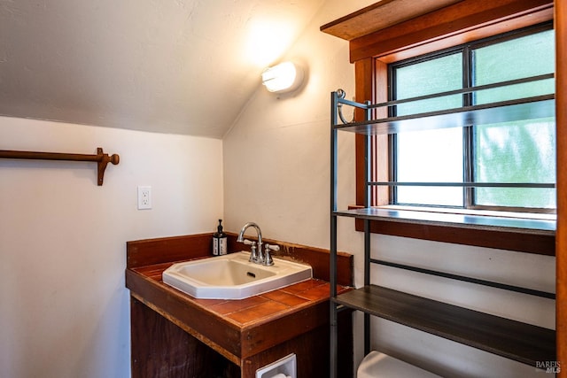 5900 Blank Rd, Sebastopol, CA 95472 - half bath with vaulted ceiling, a sink, and toilet