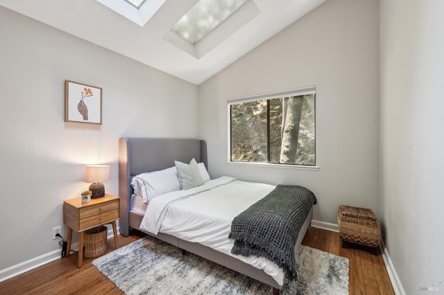 280 Oakcrest Rd, San Anselmo, CA 94960 - bedroom with a skylight, wood finished floors, lofted ceiling, and baseboards