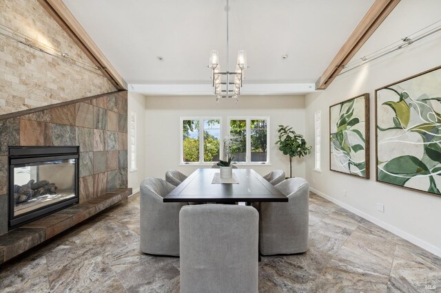 41 Cypress Rd, Point Reyes Station, CA 94956 - dining space with baseboards, a tiled fireplace, stone finish floors, and a chandelier