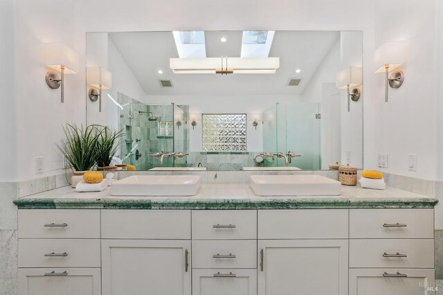 41 Cypress Rd, Point Reyes Station, CA 94956 - bathroom featuring a skylight, a stall shower, double vanity, and lofted ceiling
