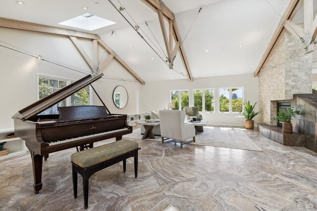 41 Cypress Rd, Point Reyes Station, CA 94956 - living area featuring high vaulted ceiling, a skylight, marble tiled flooring, and a fireplace