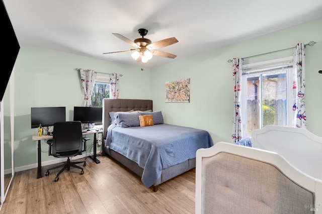 1225 Arkansas St, Vallejo, CA 94590 - bedroom with light wood-style flooring, a ceiling fan, baseboards, and a desk