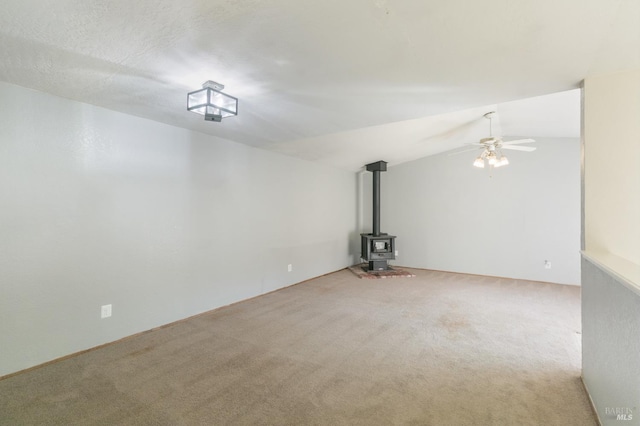 2728 Almondwood Way, Fairfield, CA 94534 - unfurnished living room with a wood stove, a ceiling fan, carpet, and lofted ceiling