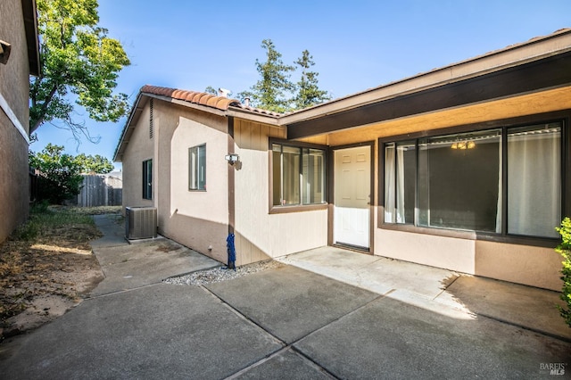 2728 Almondwood Way, Fairfield, CA 94534 - rear view of house with a tile roof, a patio, cooling unit, and stucco siding