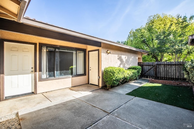 2728 Almondwood Way, Fairfield, CA 94534 - property entrance featuring a patio and stucco siding