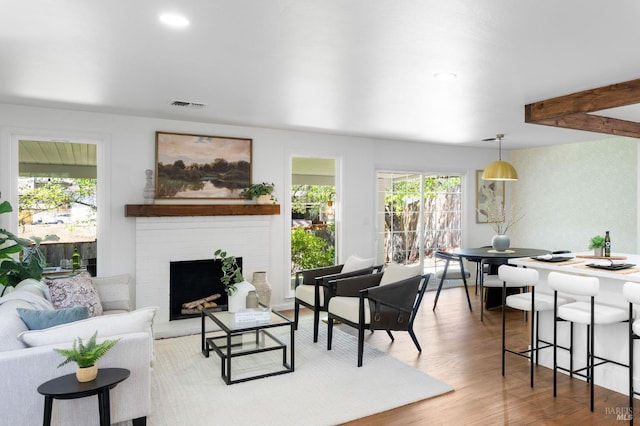 1109 Broadmoor Dr, Napa, CA 94558 - living area featuring a fireplace, wood finished floors, recessed lighting, and beam ceiling